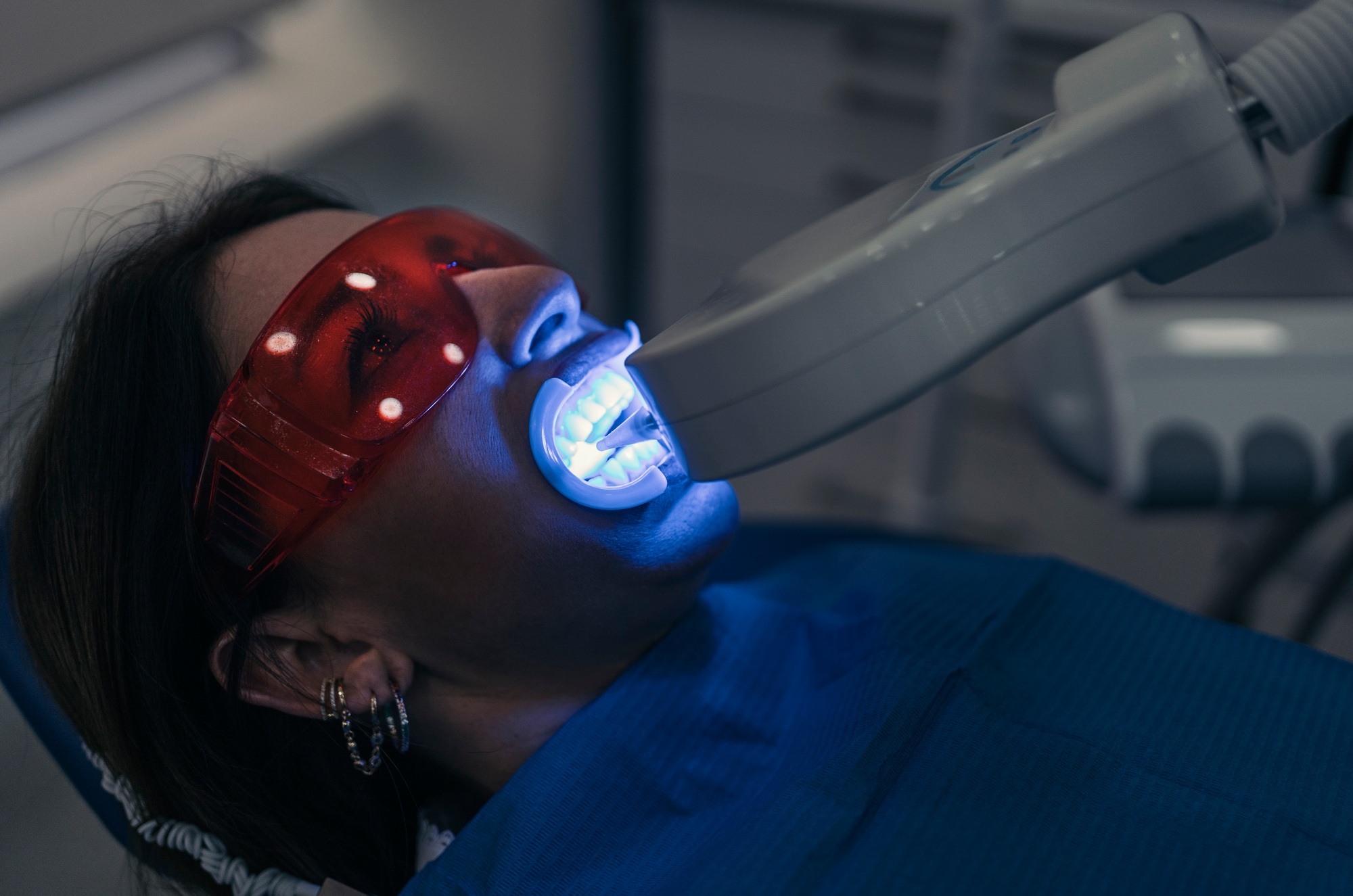 Woman Doing Tooth Whitening Treatment